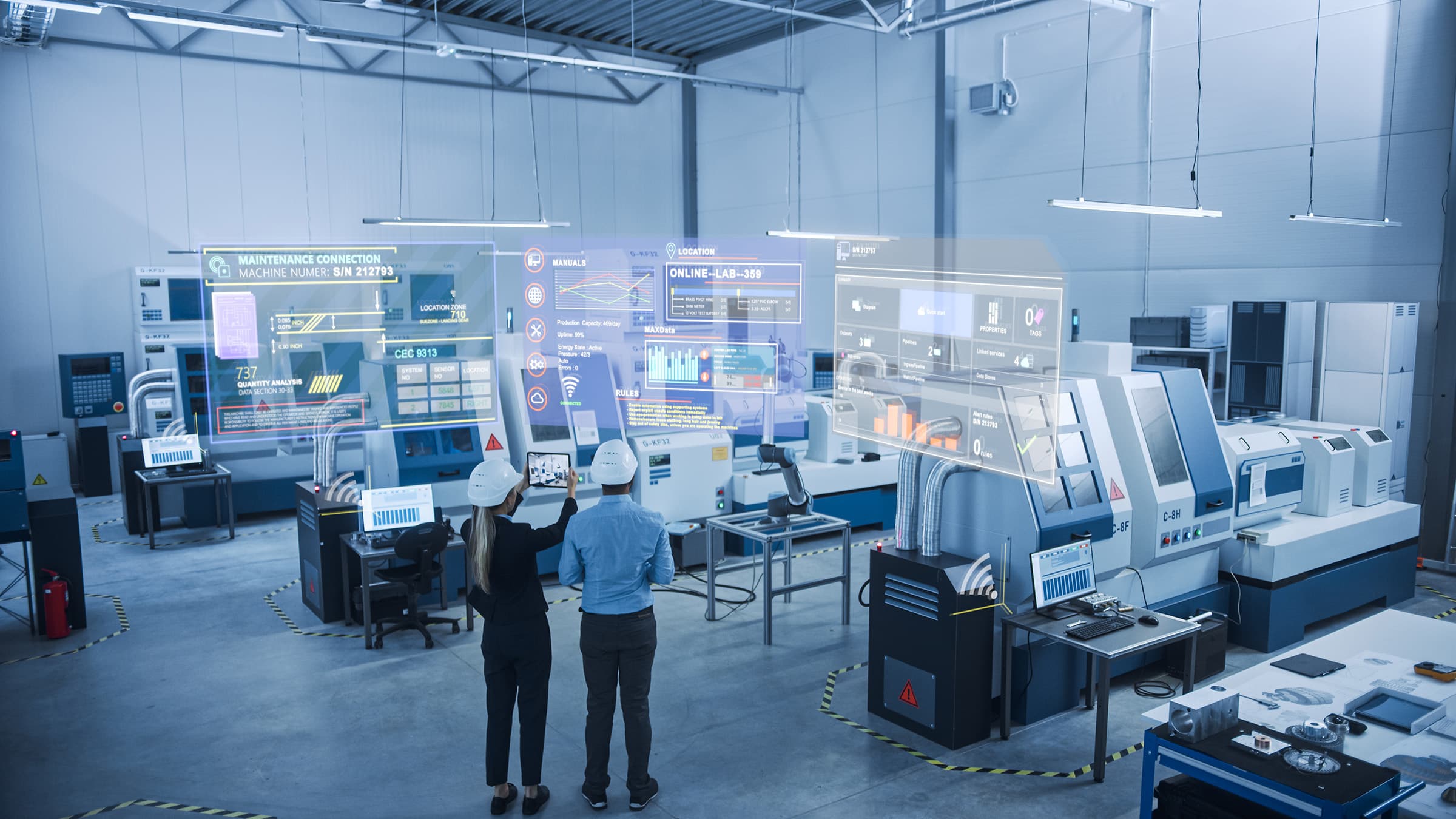 Engineers in a smart factory analyzing holographic data displays among advanced automated machinery.